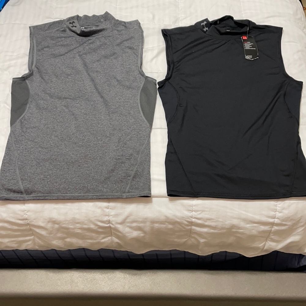 Two under armour tank tops, one with tags but both of them are new.